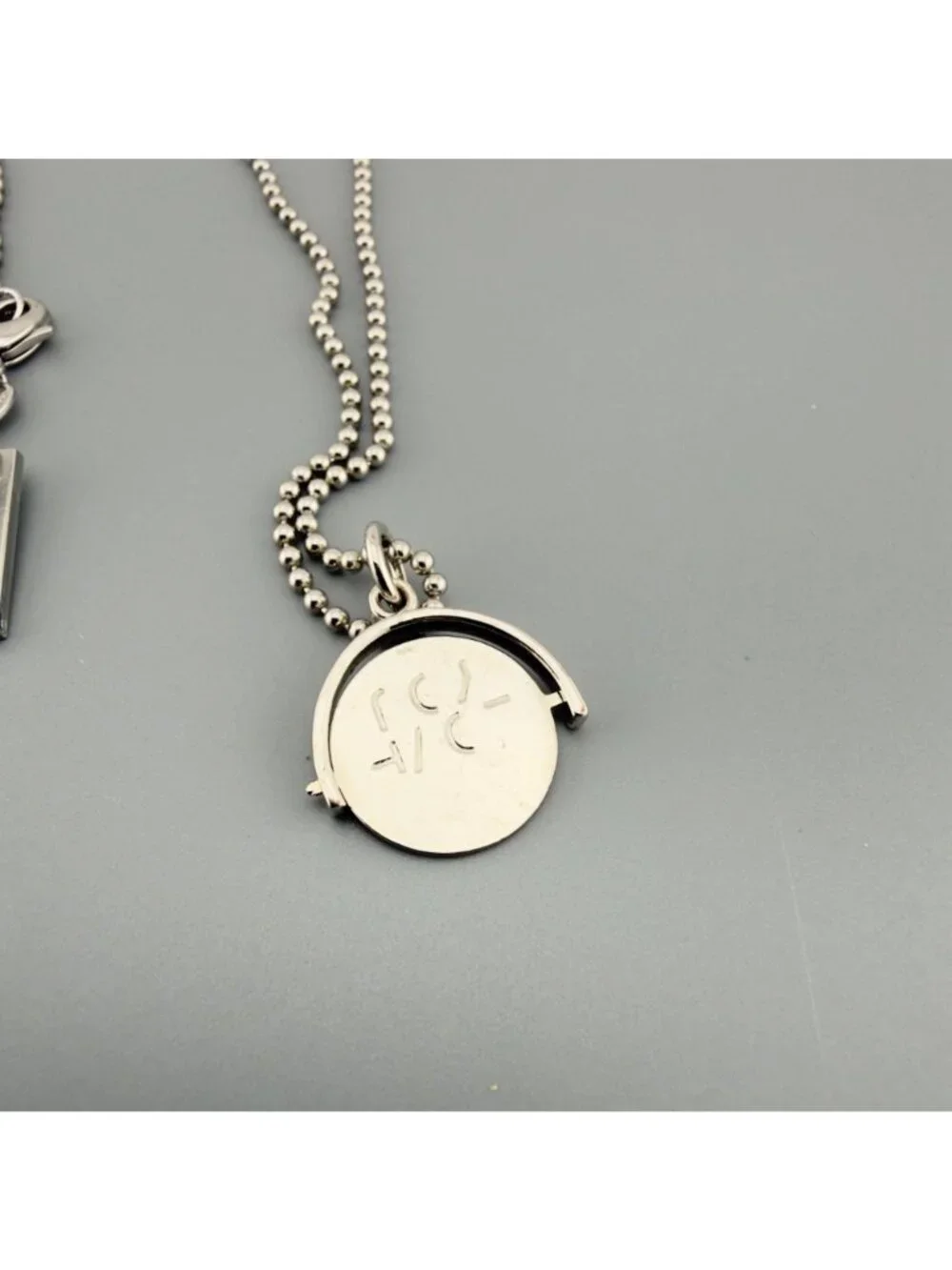 Marc Jacobs Spinner Pendant Charm Necklace P.S. I Love You Message Silver Tone